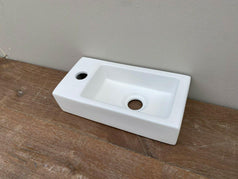 Small WALL HUNG Matte White Basin vanity powder w Black pop up plug bottle trap