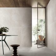 Light grey stone look outdoor tile installation and interior design.