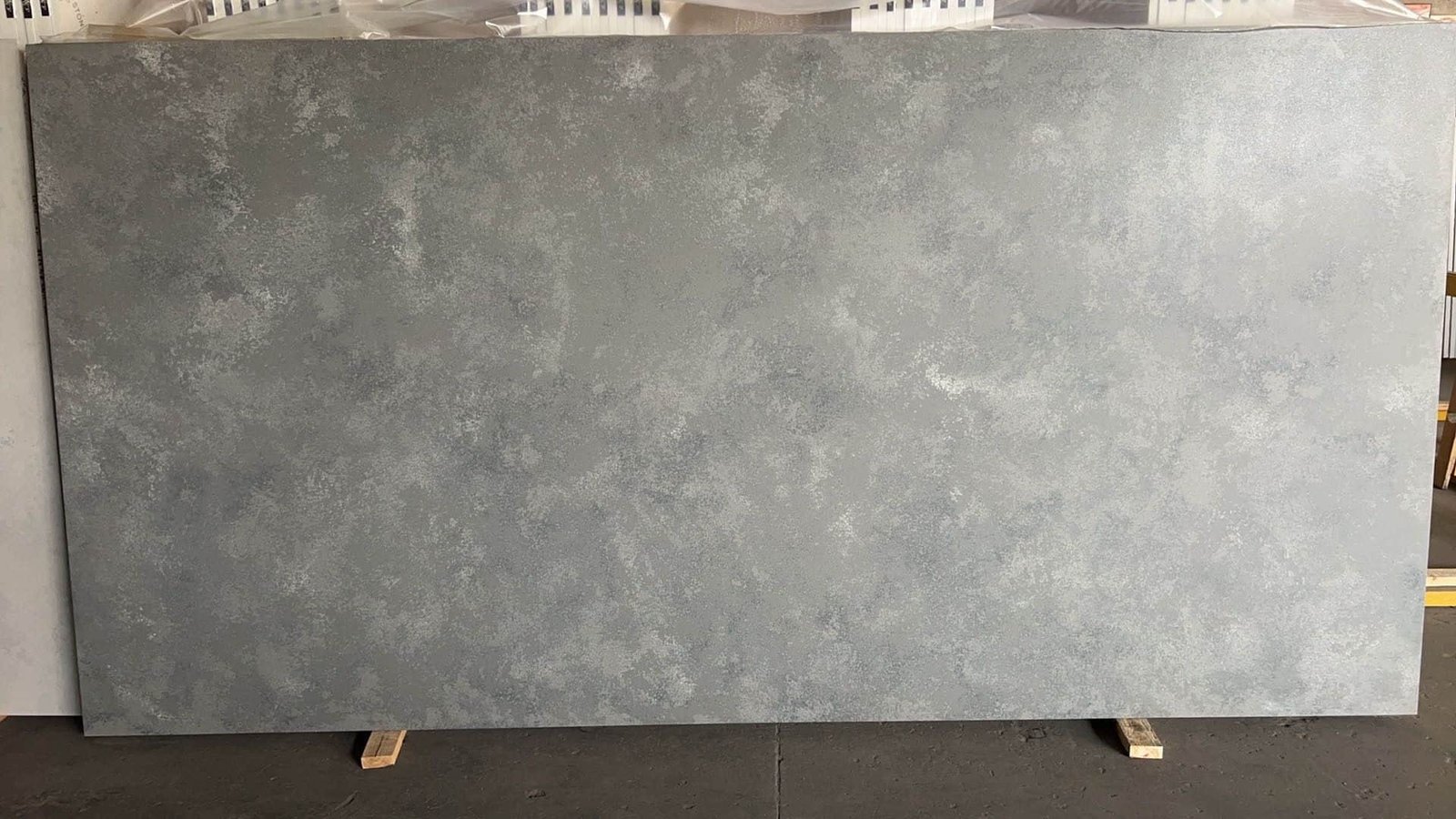 Anatolian Steel engineered stone slab with leathered finish, showcasing deep steel-green tones.