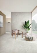 Espera Ivory Carving Glaze Porcelain Tile flooring in a modern interior design.