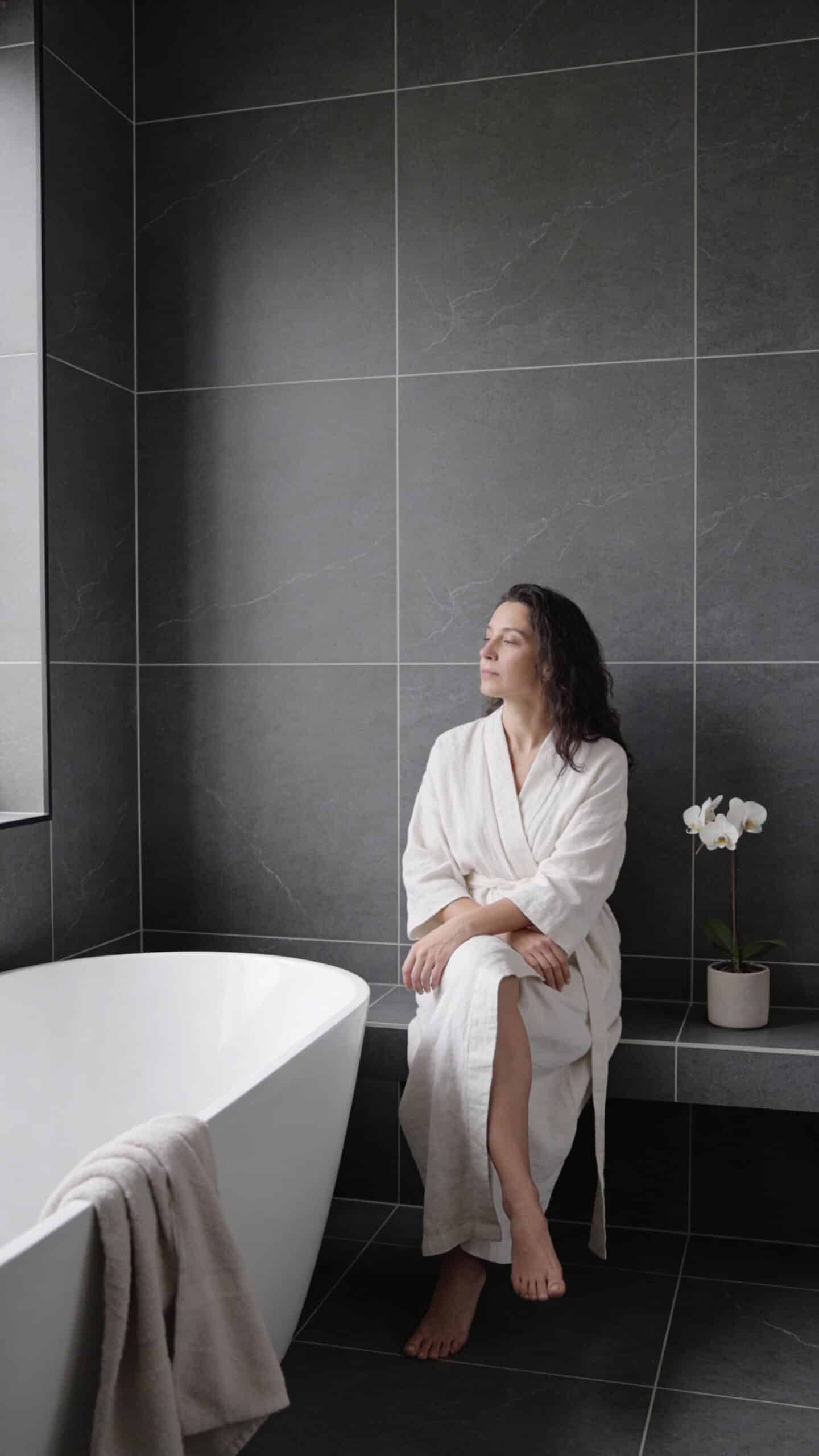 Charcoal tile bathroom interior showcasing TK6009M tile and modern minimalist design.