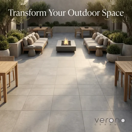 Outdoor space transformed with grey porcelain tiles and modern outdoor furniture.