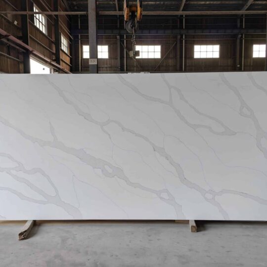 Golden Silk engineered stone slab with delicate grey veining, jumbo slab application for kitchen benchtops.