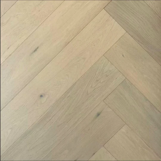 European oak herringbone flooring pattern showcasing wide-plank design and micro bevel edges.