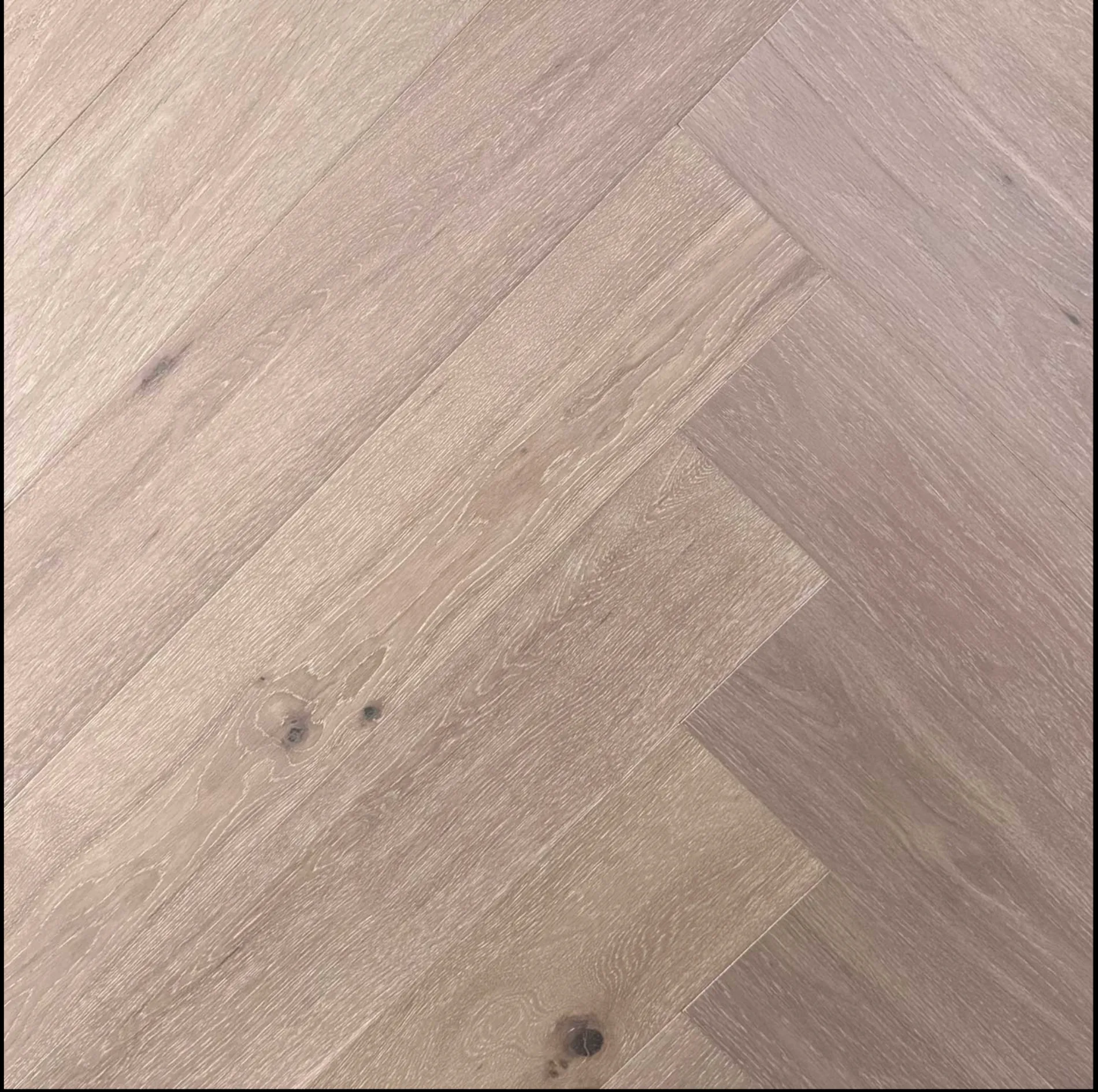European Oak engineered herringbone flooring, textured wood grain detail