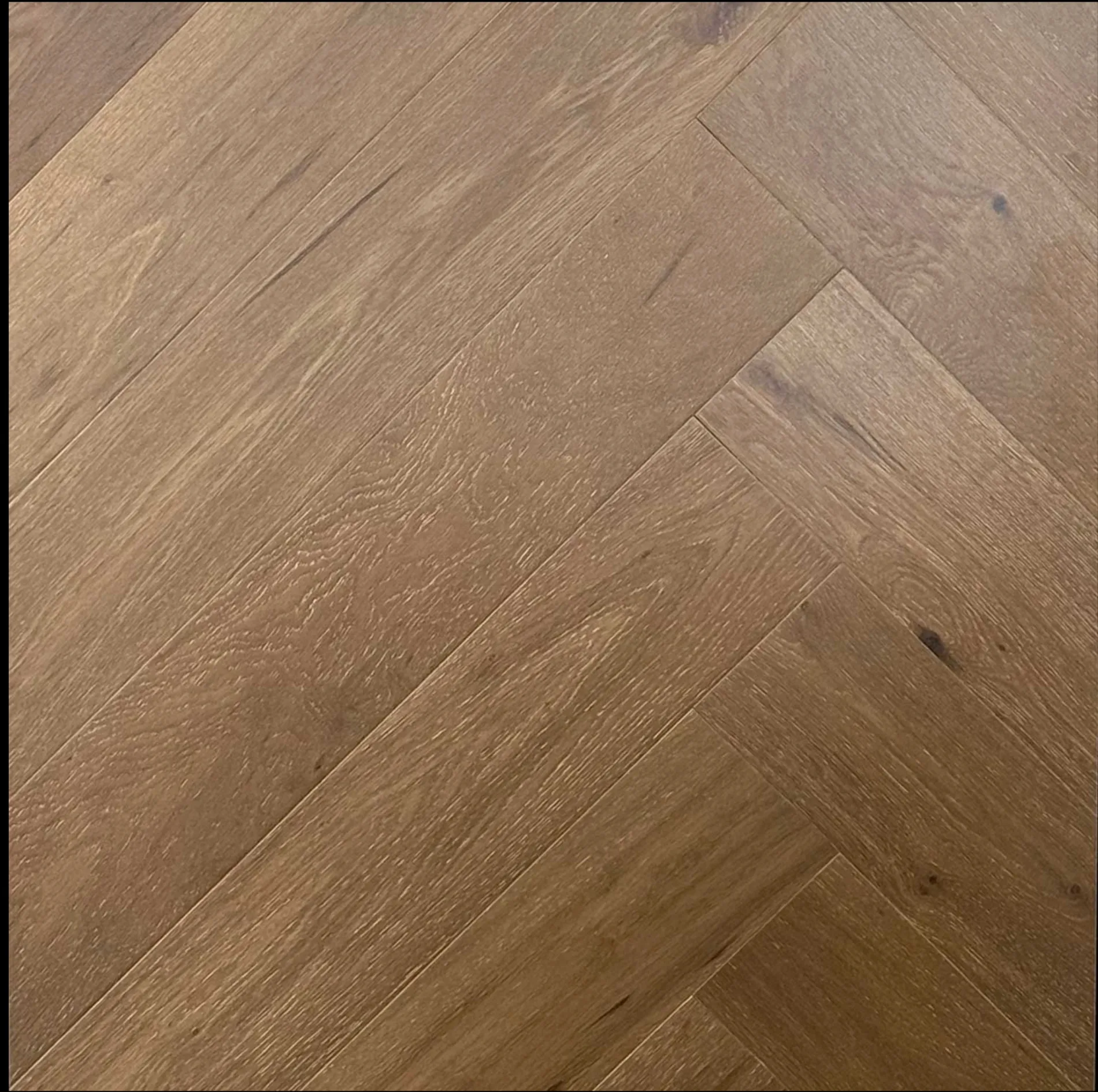 Dull Gold Engineered European Oak Flooring with Matt Brushed finish, herringbone pattern.
