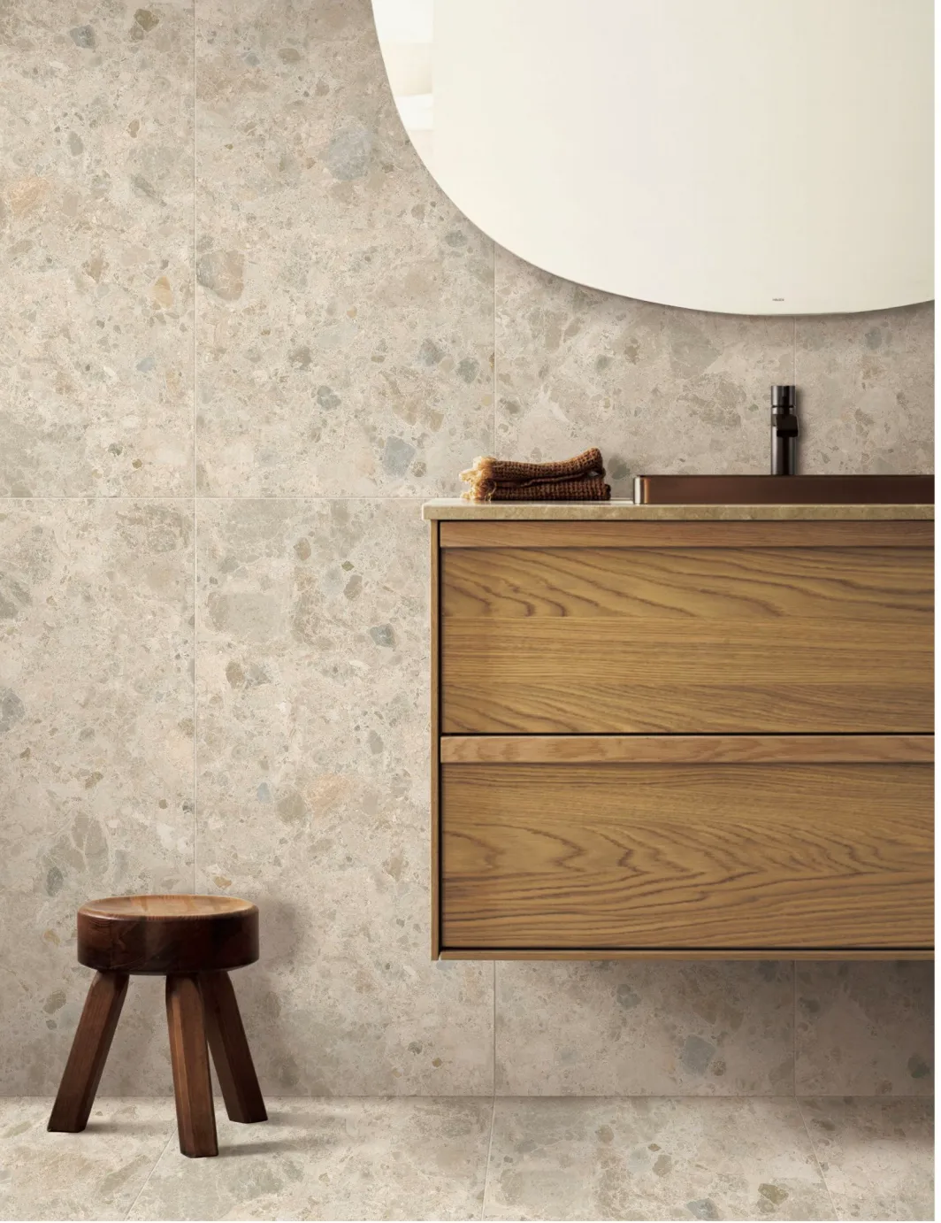 Middle Grey Stone Look Porcelain Tile installed in bathroom setting with vanity and stool.