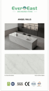 Golden Silk engineered stone kitchen island with grey veining and integrated sink.